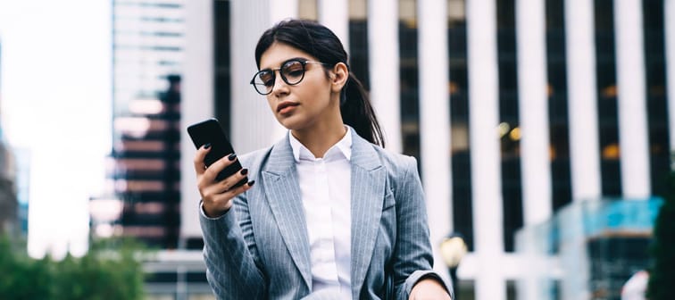 Latino businesswoman using a smartphone