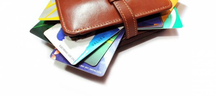 Credit cards in wallet on a white background.