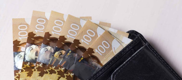 Canadian Dollars in a open black leather vallet